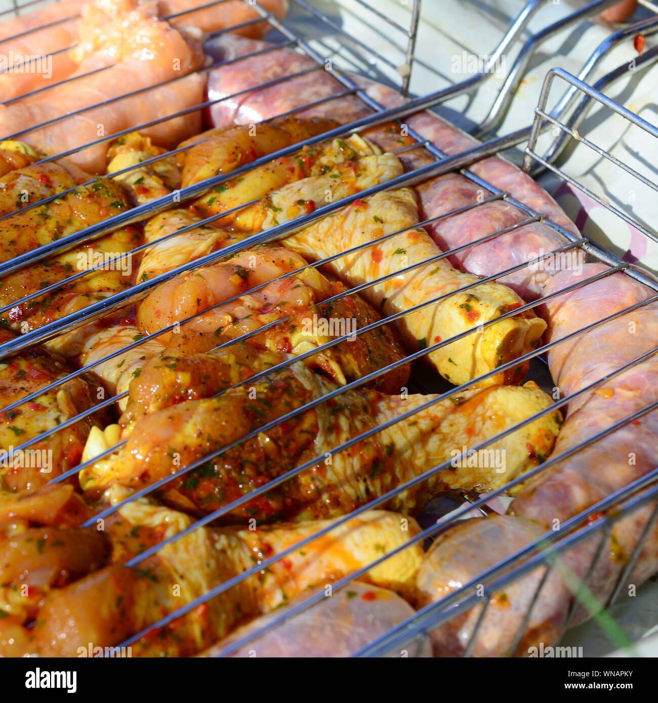 Delicious chicken legs on garden grill. Marinated Chicken Legs On The