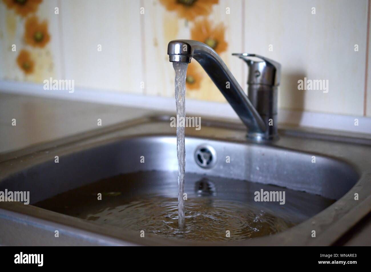 Stainless steel sink plug hole close up 