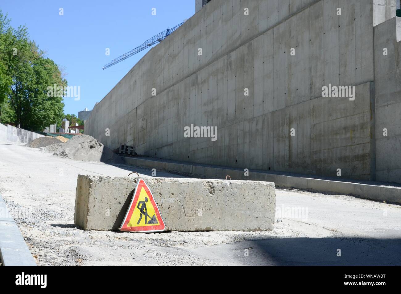 Road works sign for construction works in city street. Road under ...