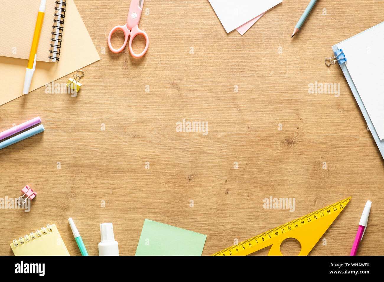 https://c8.alamy.com/comp/WNAWF0/flat-lay-school-stationery-on-a-wooden-background-back-to-school-concept-creative-layout-top-view-overhead-WNAWF0.jpg