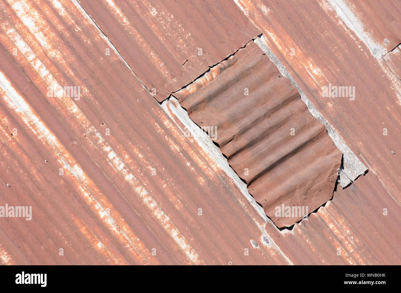 Rusted corrugated metal roof sheets in various shades of brown Stock Photo