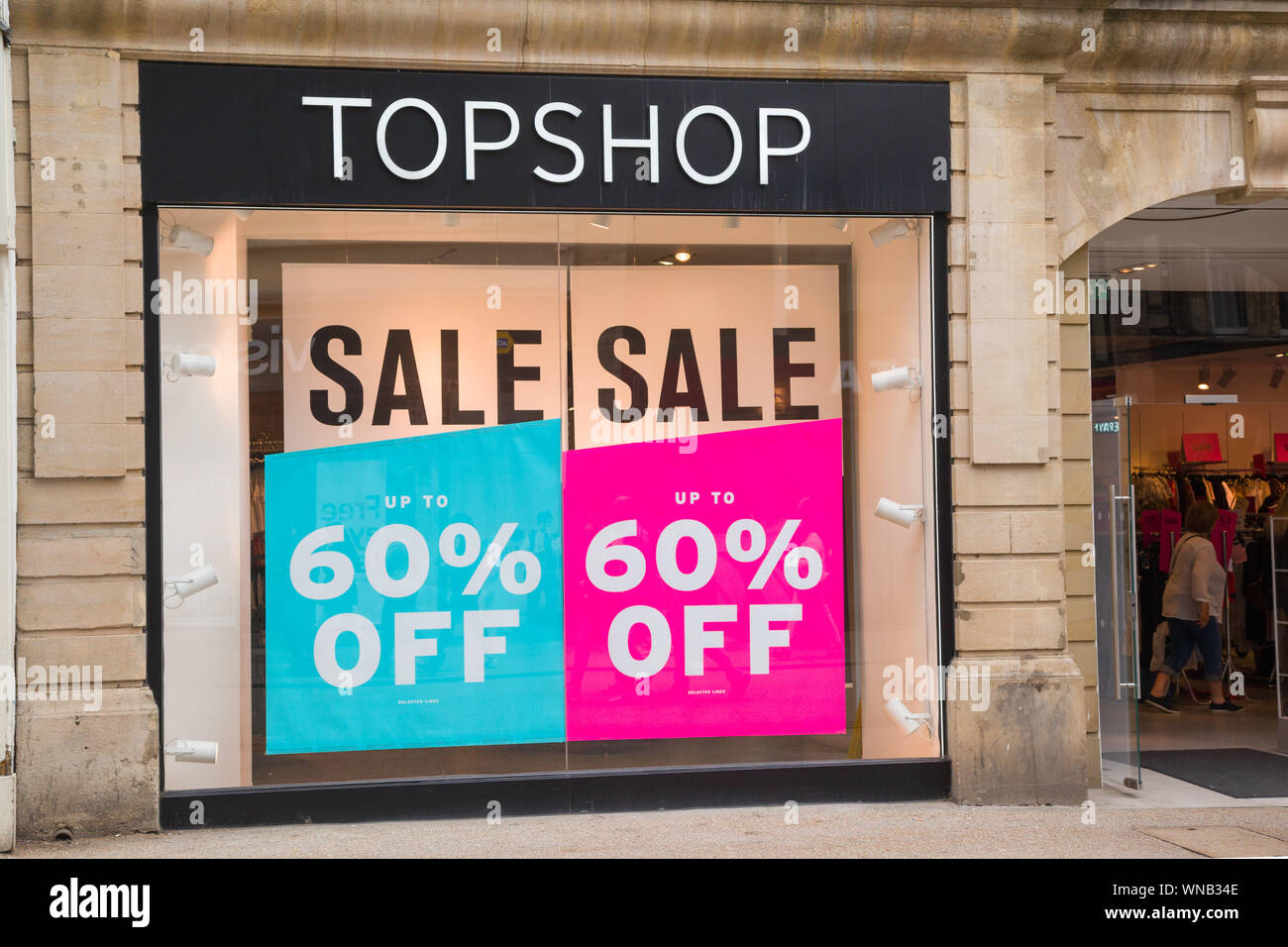 The outside of the Topshop clothing store in Oxford with 60% off sales  advertised in the windows Stock Photo - Alamy