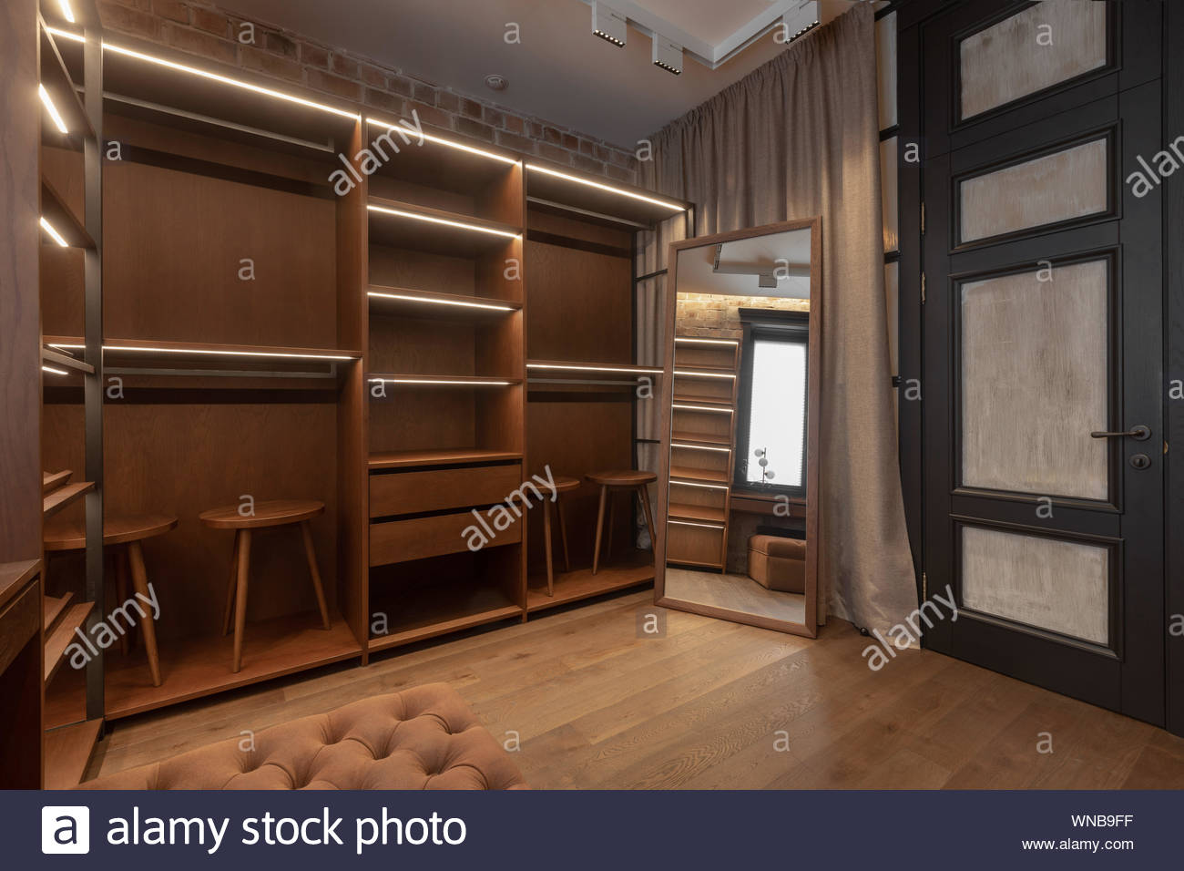 Elegant Interior Of Modern Dressing Room With Spacious Wooden