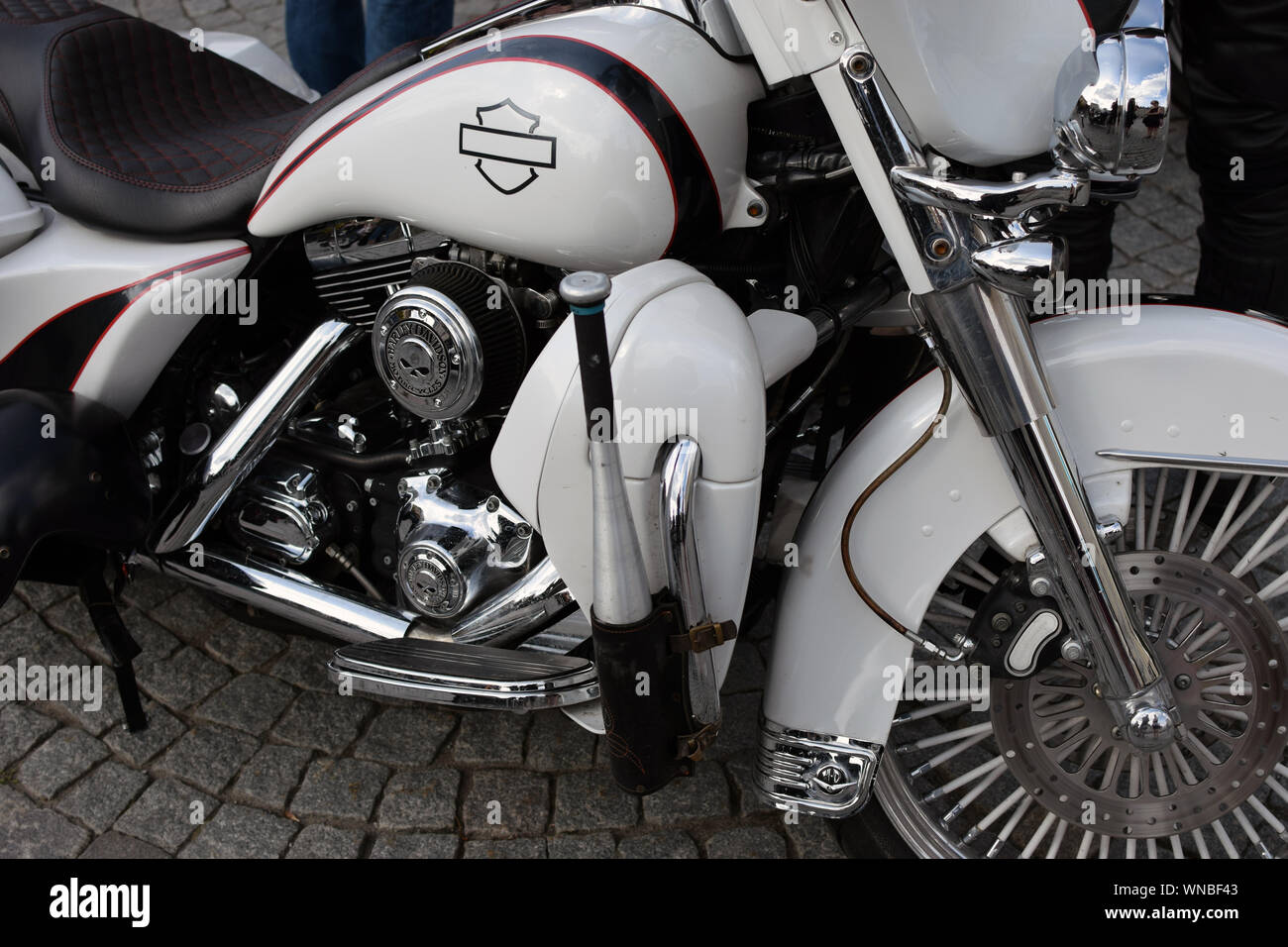 Close up of white Harley Davidson with baseball bat and holder. Stock Photo