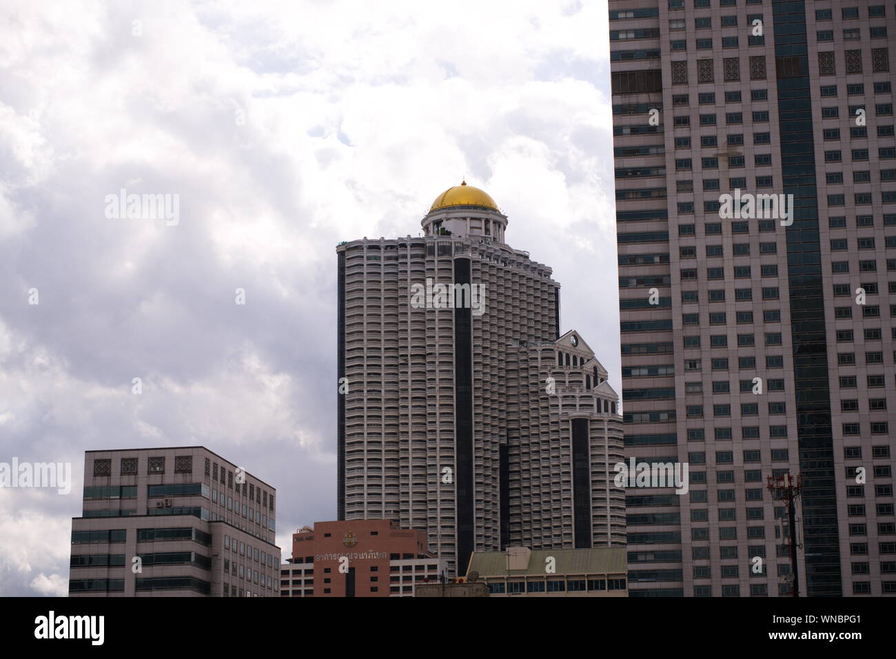 Cloudy sky of State Tower The Golden Dome and Building Around. Bangkok, Thailand in 2019, 6th September Stock Photo