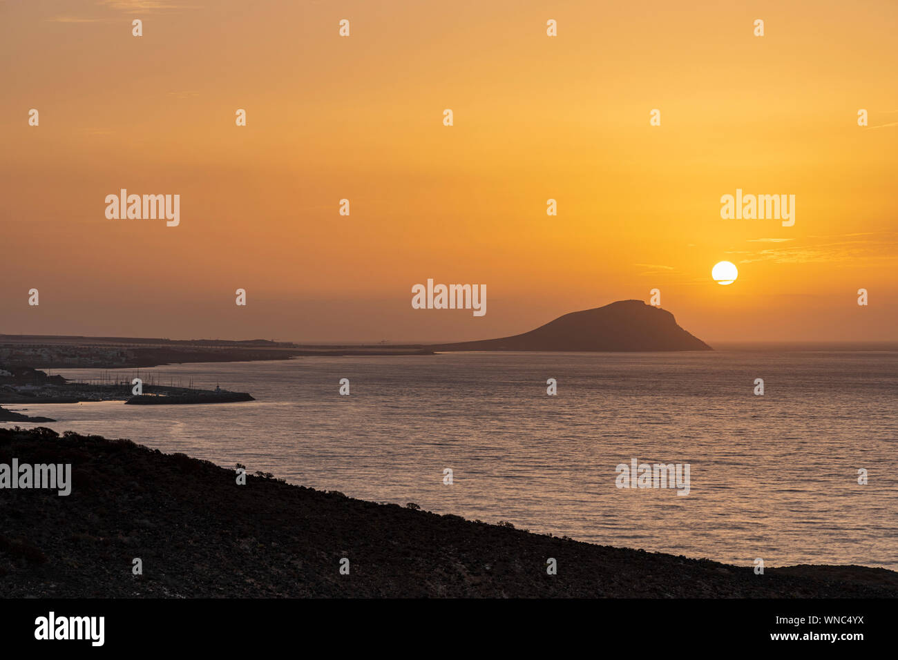 Sunrise over Montana Rojo from Montana Amarilla, Costa Silencio, early morning, Tenerife, Canary Islands, Spain Stock Photo