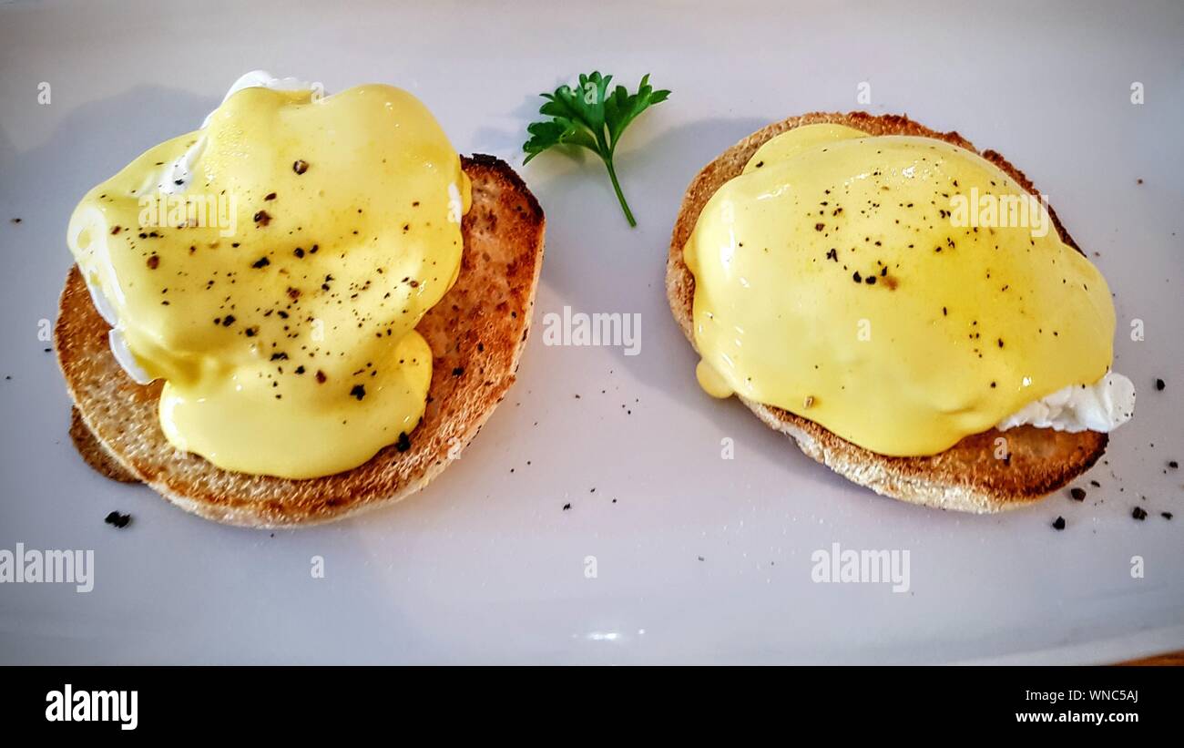 Close-up Of Eggs Benedicts In Plate Stock Photo
