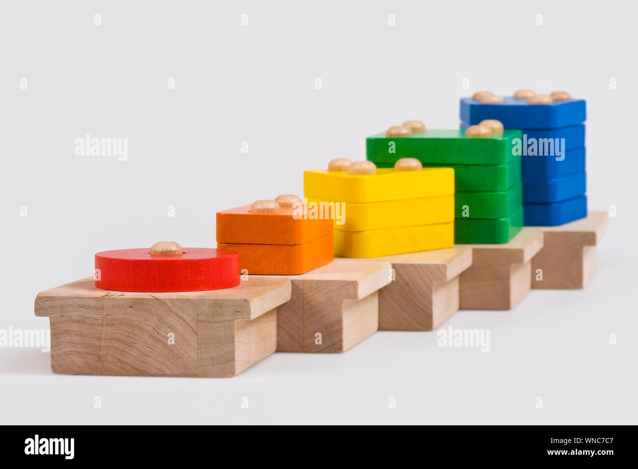 Wooden baby blocks on a white background Stock Photo - Alamy