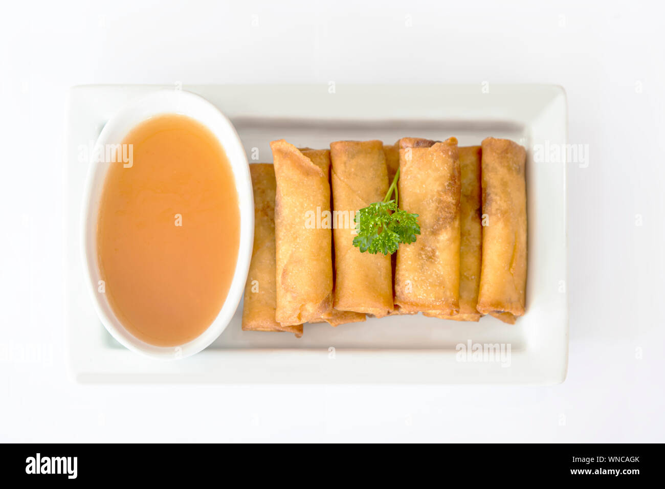 Chinese fried spring rolls served with a tomato spicy sauce Stock Photo
