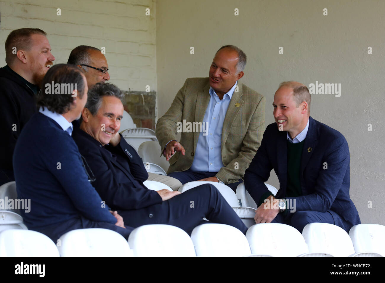 Duke of Cambridge and Rob Morris, Co-Owner of Silver Jubilee Park and Hon Vice President of Hendon FC and Edware Town FC speak to club officials, during his visit to Hendon FC in London to learn more about the club's mental health outreach initiatives. PA Photo. Picture date: Friday September 6, 2019. See PA story ROYAL Cambridge. Photo credit should read: Tim Whitby/PA Wire Stock Photo