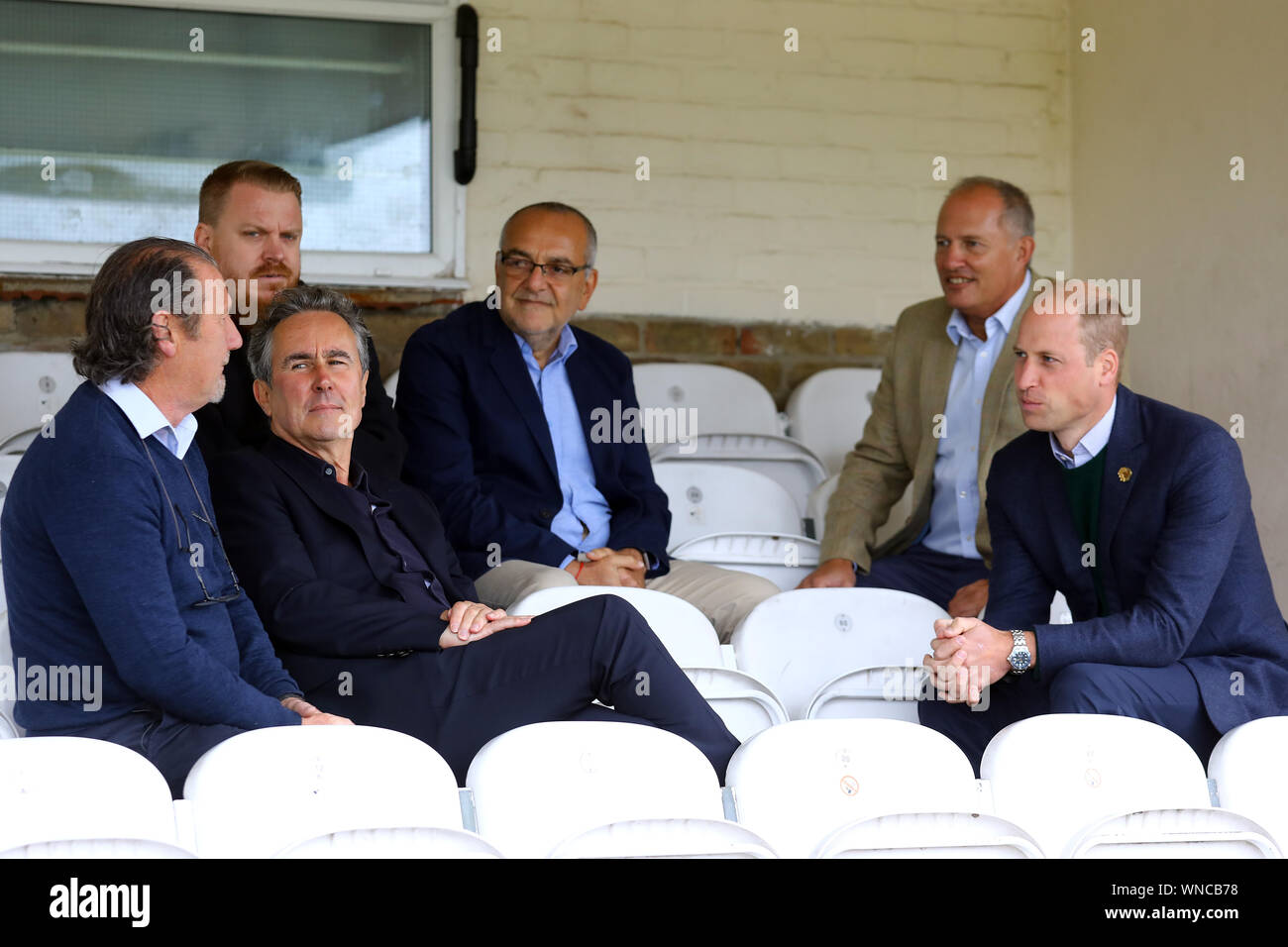 Duke of Cambridge and Rob Morris, Co-Owner of Silver Jubilee Park and Hon Vice President of Hendon FC and Edware Town FC speak to club officials, during his visit to Hendon FC in London to learn more about the club's mental health outreach initiatives. PA Photo. Picture date: Friday September 6, 2019. See PA story ROYAL Cambridge. Photo credit should read: Tim Whitby/PA Wire Stock Photo