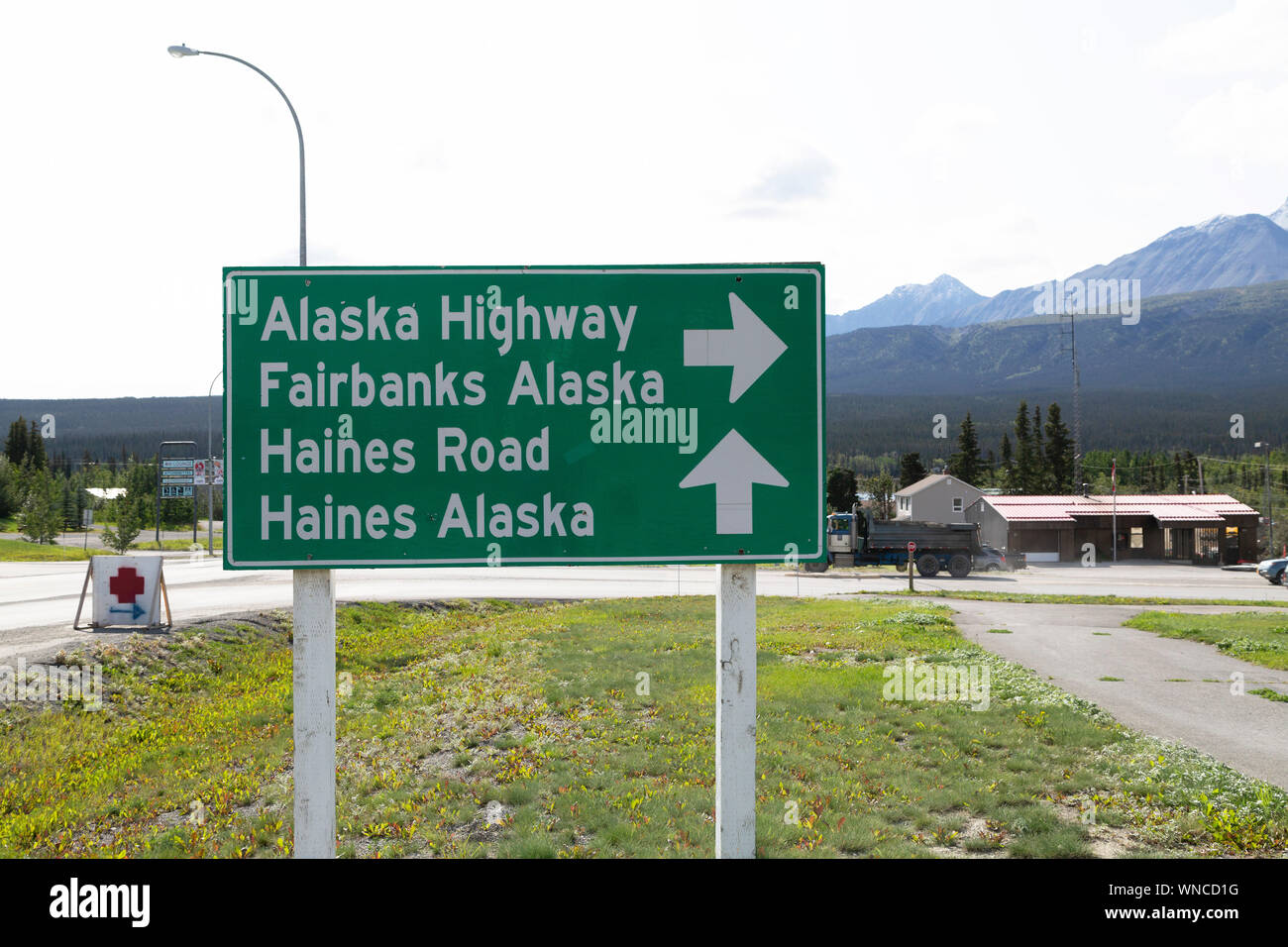 Road sign on the Alaska Highway at Haines Junction in the Yukon, Canada. The highway was constructed during World War Two running through the Yukon to Stock Photo