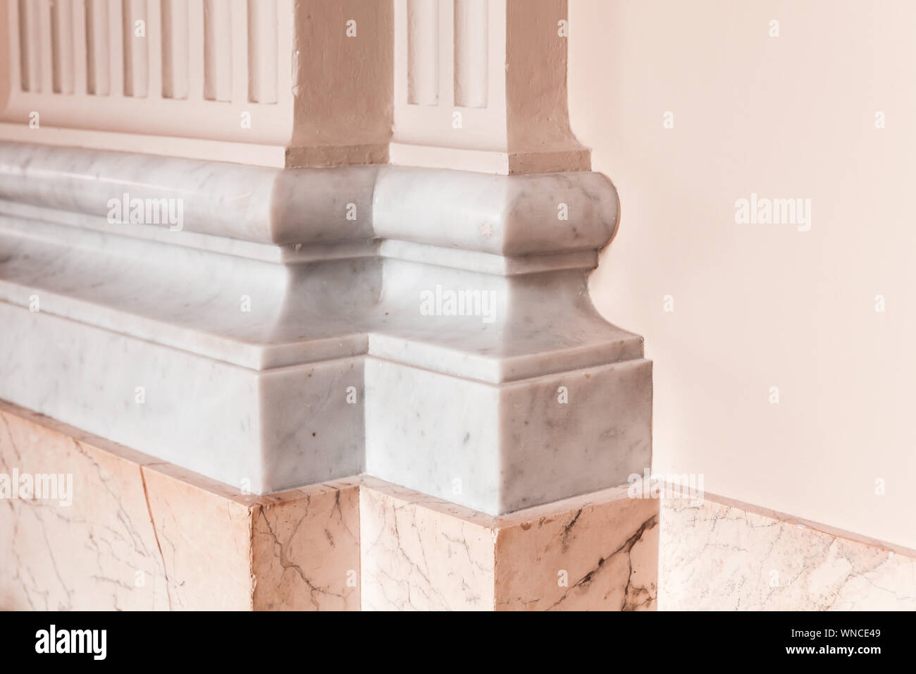 Classic luxury interior fragment, decorative pink column with white ...