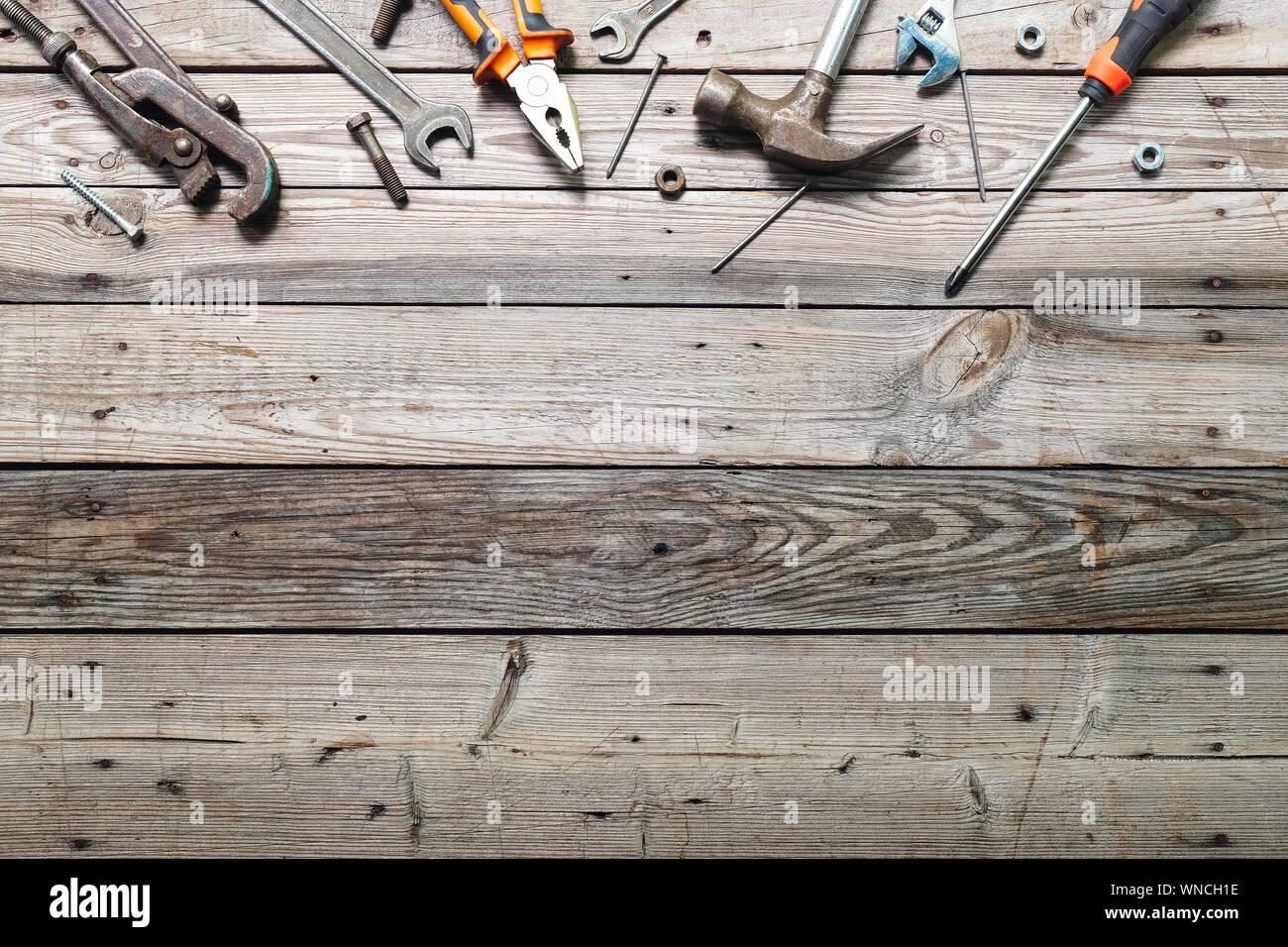 Flat lay composition with vintage carpentry tools on rough wooden