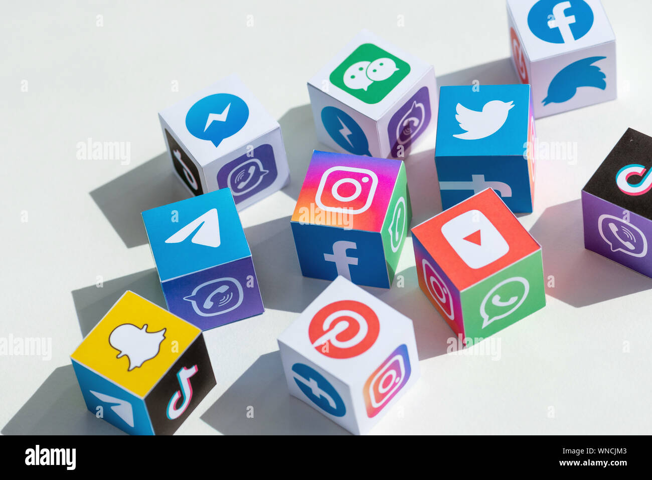 A paper cubes collection with printed logos of world-famous social networks and online messengers. Stock Photo