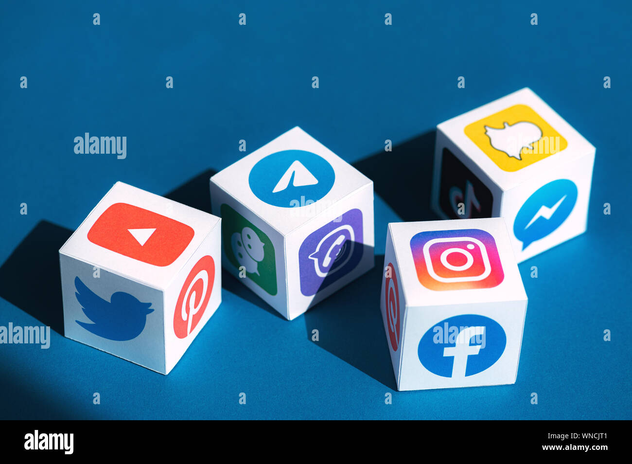 A paper cubes collection with printed logos of world-famous social networks and online messengers. Stock Photo
