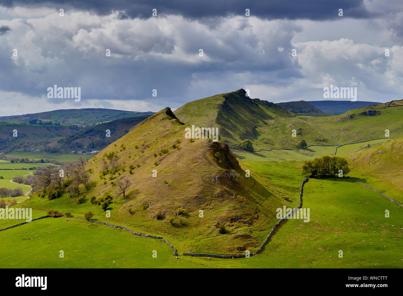 Parkhouse and Chrome Hill in the sun taken from Hitter Hill while storm clouds gather overhead, Peak District National Park, Derbyshire, England, UK Stock Photo