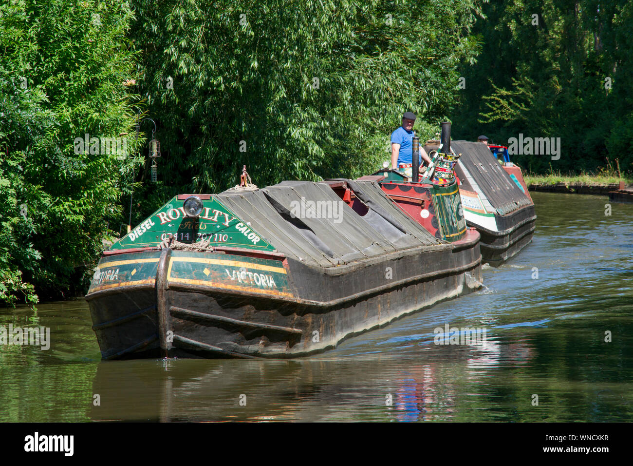 Royalty class narrowboat Victoria with butty Mercury, Grand Union Canal, Milton Keynes. Stock Photo