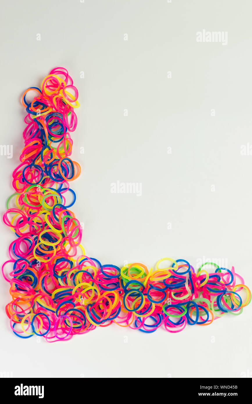 Closeup Of Letter L Made With Colorful Rubber Bands Over White Background Stock Photo Alamy