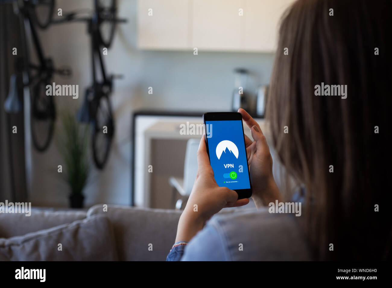 Privacy consider girl uses a security app on her phone Stock Photo