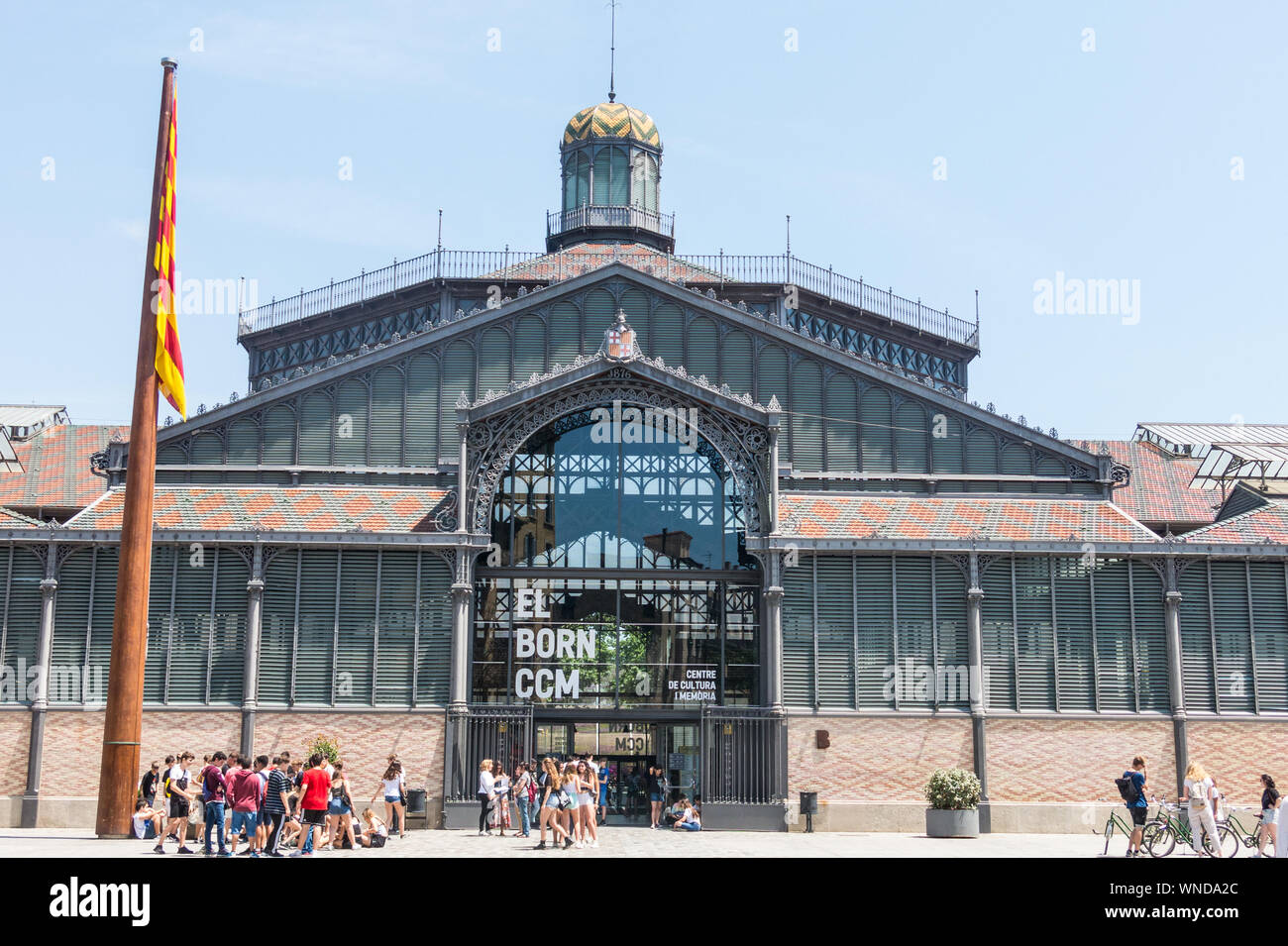 BARCELONA - JUNE 20, 2019: Tourits from the facade of Born market. It is an example of iron architecture, a movement within the modernist. Born distri Stock Photo