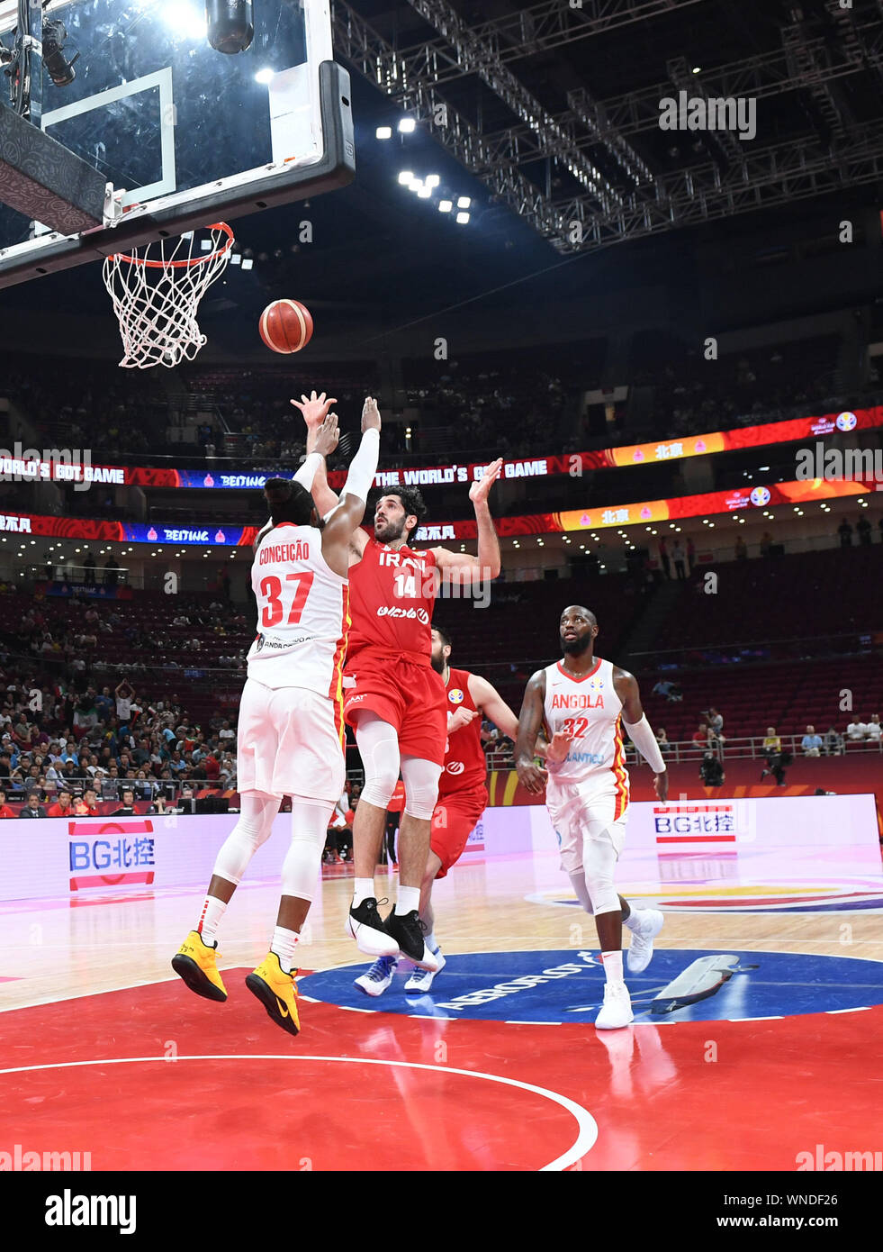 Beijing, China. 6th Sep, 2019. Mohammadsamad Nik Khahbahrami (2nd L) of  Iran shoots the ball during the group N match between Iran and Angola at  the 2019 FIBA World Cup in Beijing,