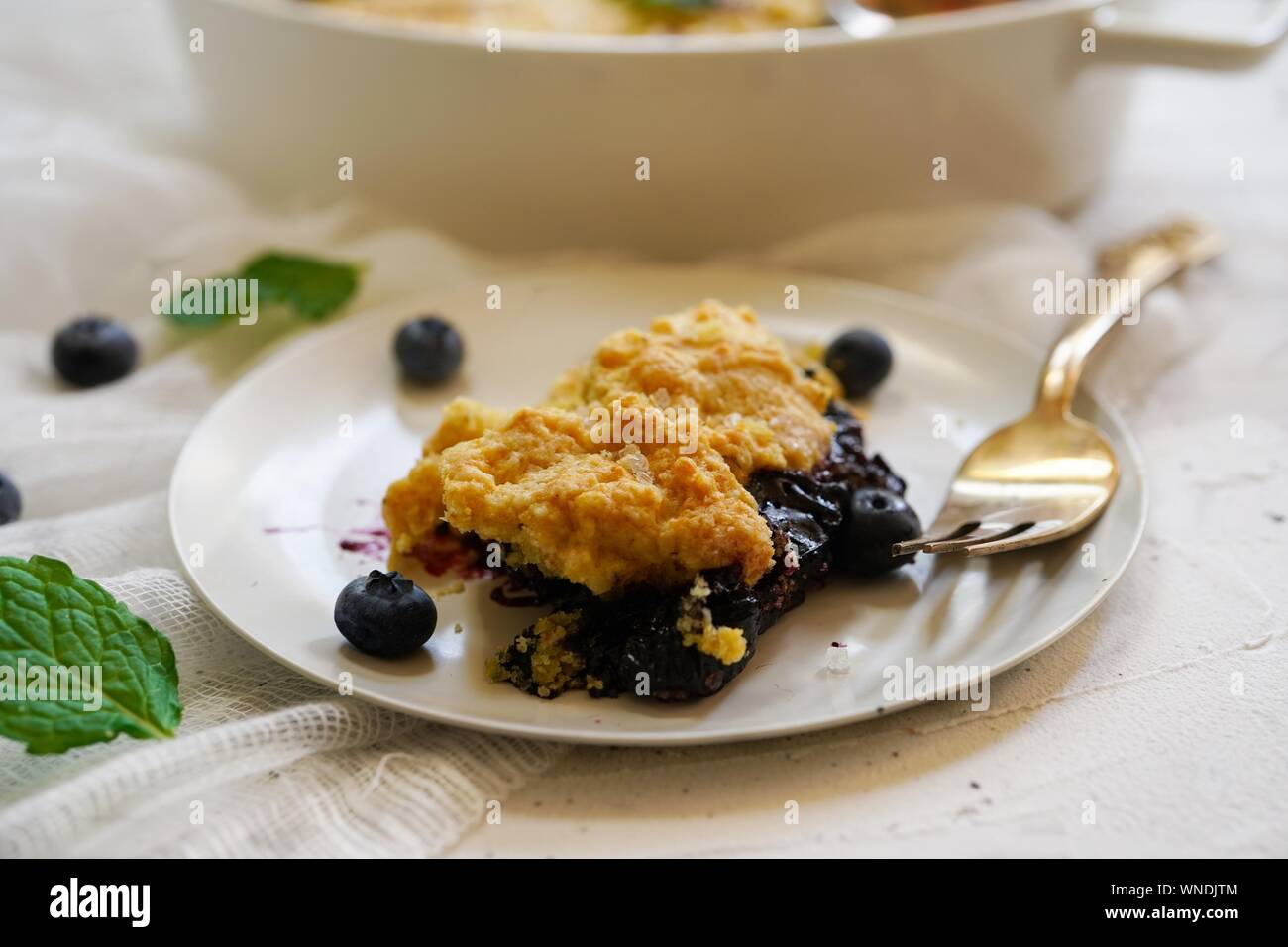 Homemade Blueberry cornmeal Cobbler baked in a Ramekin, selective focus