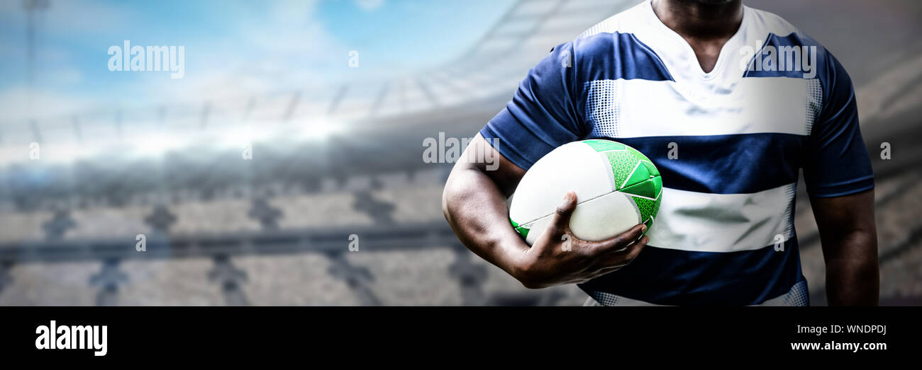 Composite image of strong rugby player Stock Photo - Alamy