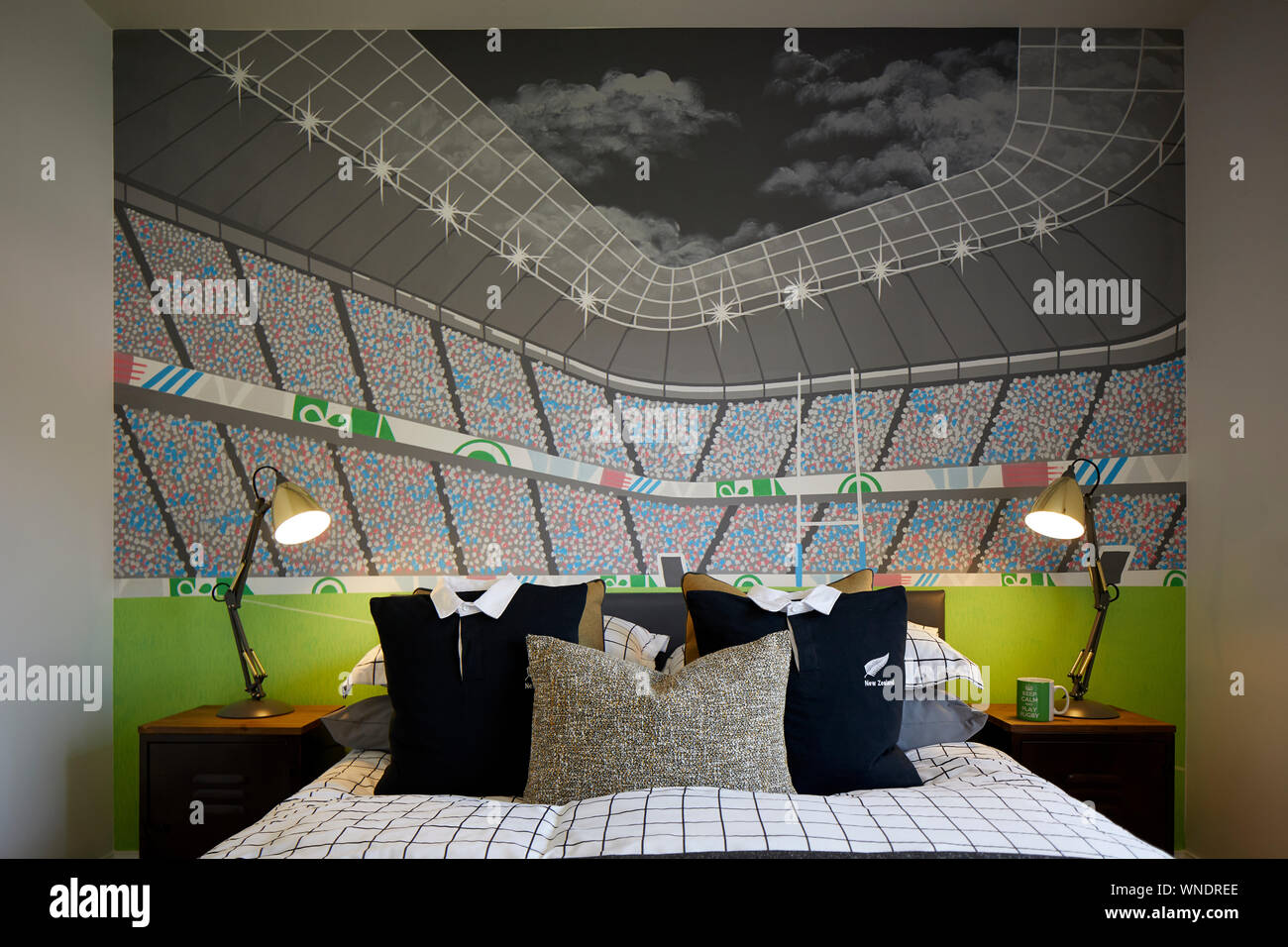 A Boys Bedroom With Stadium Mural Hand Painted With Rugby Pillow Made From Shirts Stock Photo Alamy