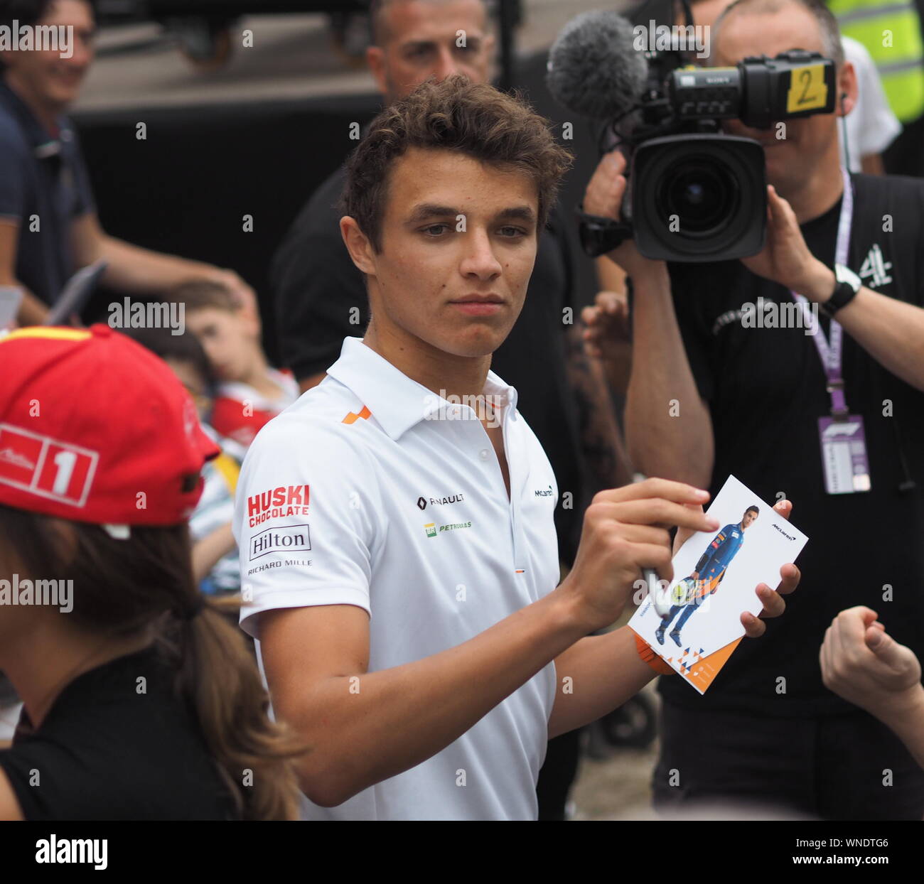 Monza, Italy 5 September 2019: Driver Carlos Sainz and Lando Norris are among fans and giving autograph in Monza circuit paddock. Stock Photo