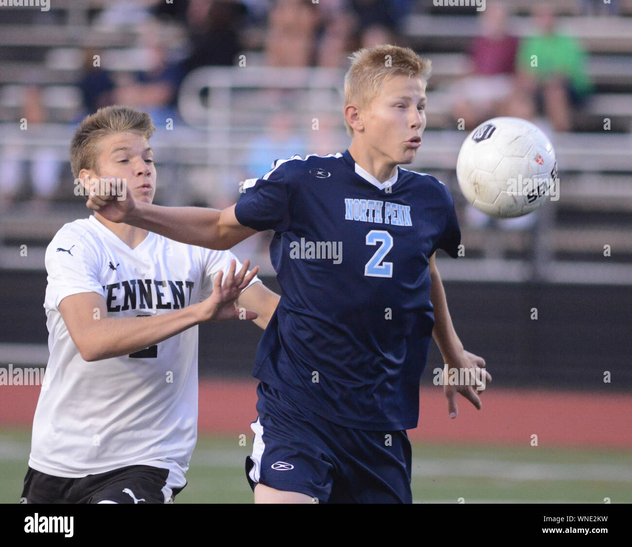 William Tennent's Max Schulze (2) chases after a loose ball with North Penn's Josh Jones (2) in the first half Tuesday, September 12, 2017 at William Stock Photo