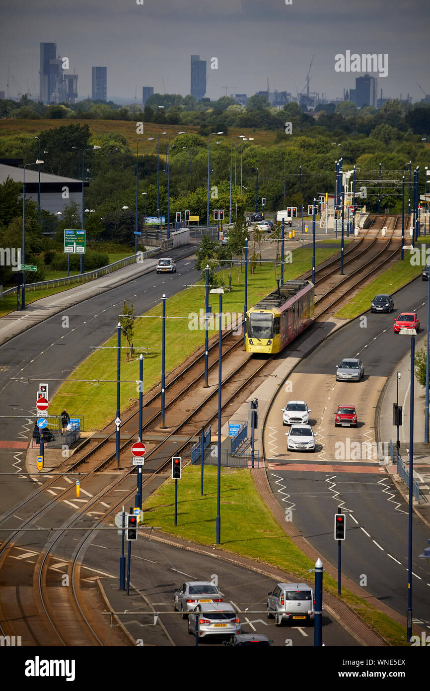 Metrolink tram in AshtonunderLyne passing the Ashton Moss Leisure