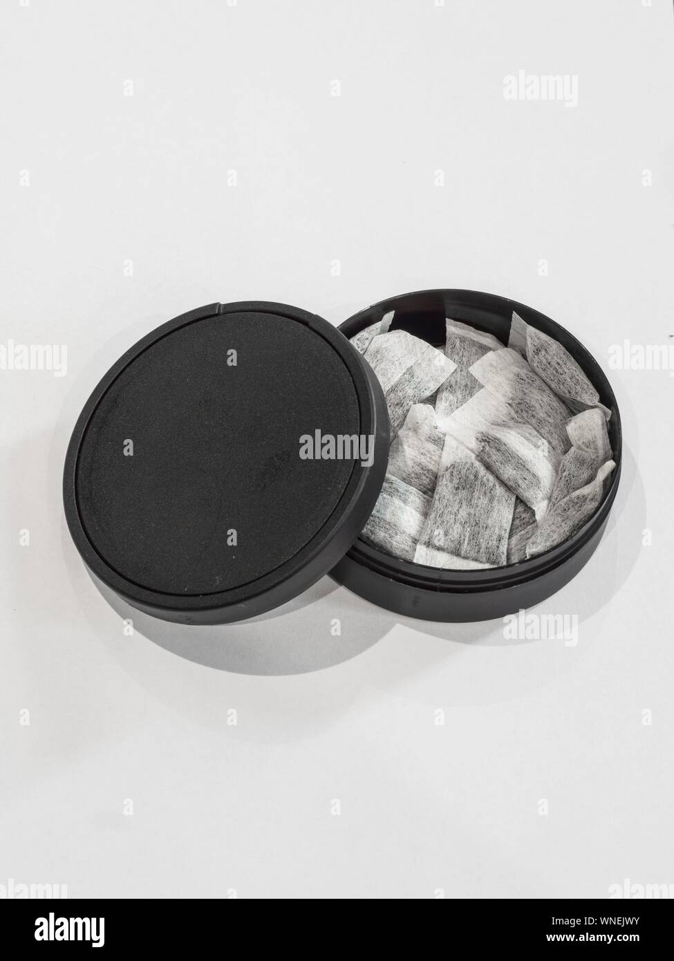 Swedish snus on white background with black box Stock Photo - Alamy