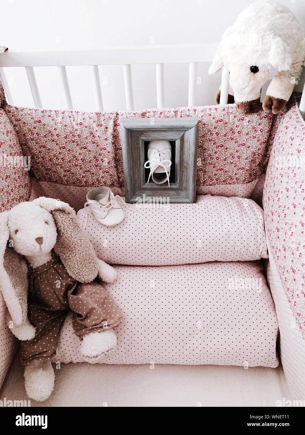 stuffed animals in crib