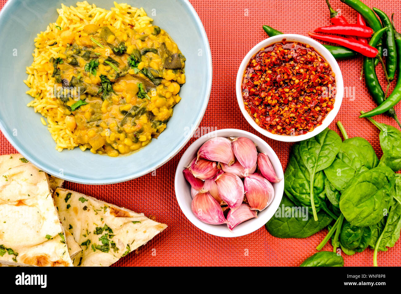 Indian Vegetarian Lentil and Spinach Curry With Pilau Yellow Rice Stock Photo