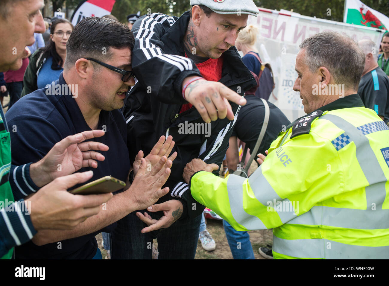 London UK 3rd Sep 2019 A Far right man is temporally detained after he attacked a anti brexit protester at End Racist Enviroment rally in Parliament square. Stock Photo