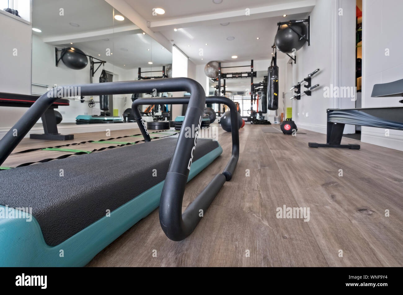 Fitness studio and gym with equipment Stock Photo Alamy