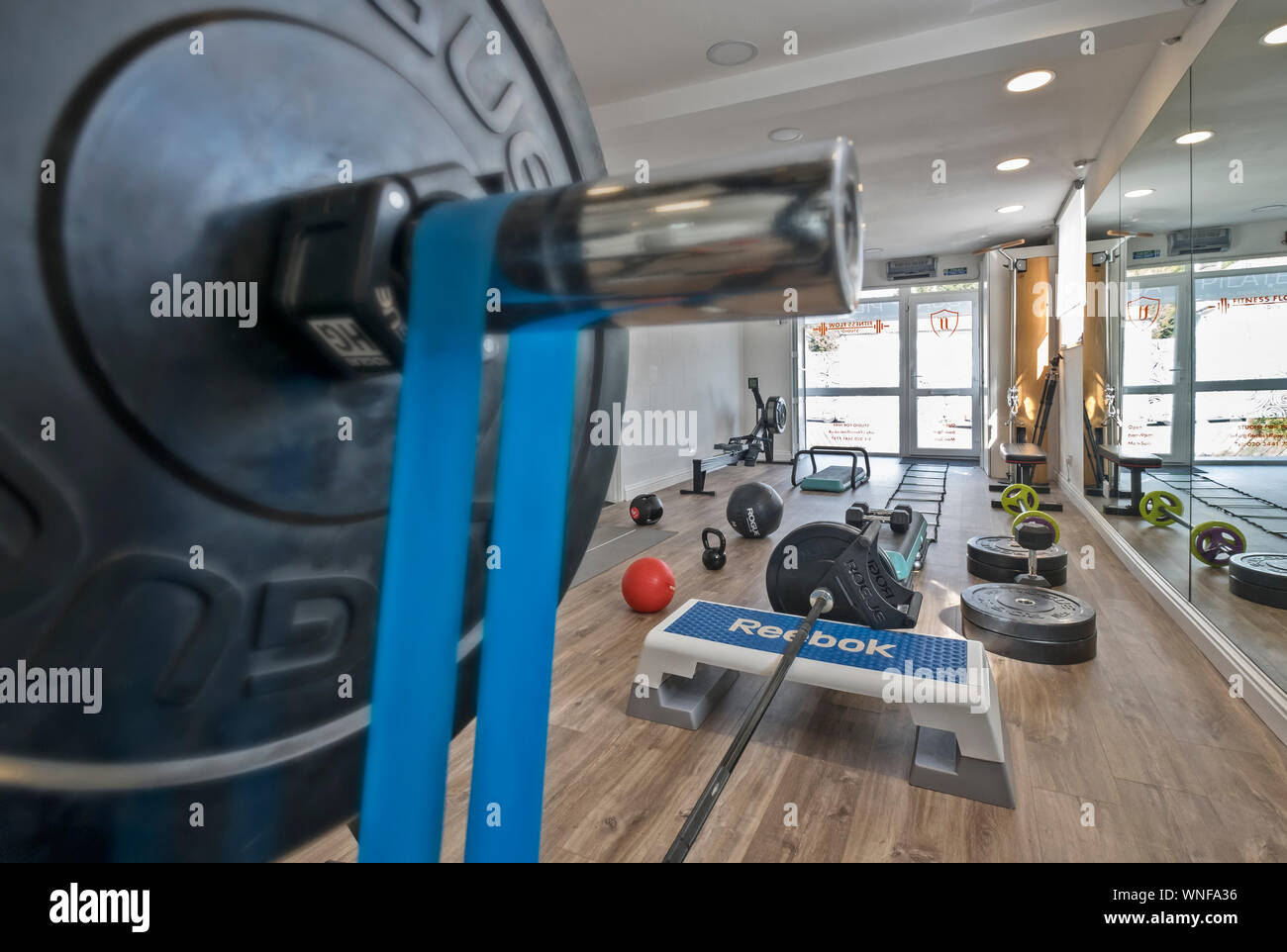 Fitness studio and gym with equipment Stock Photo - Alamy