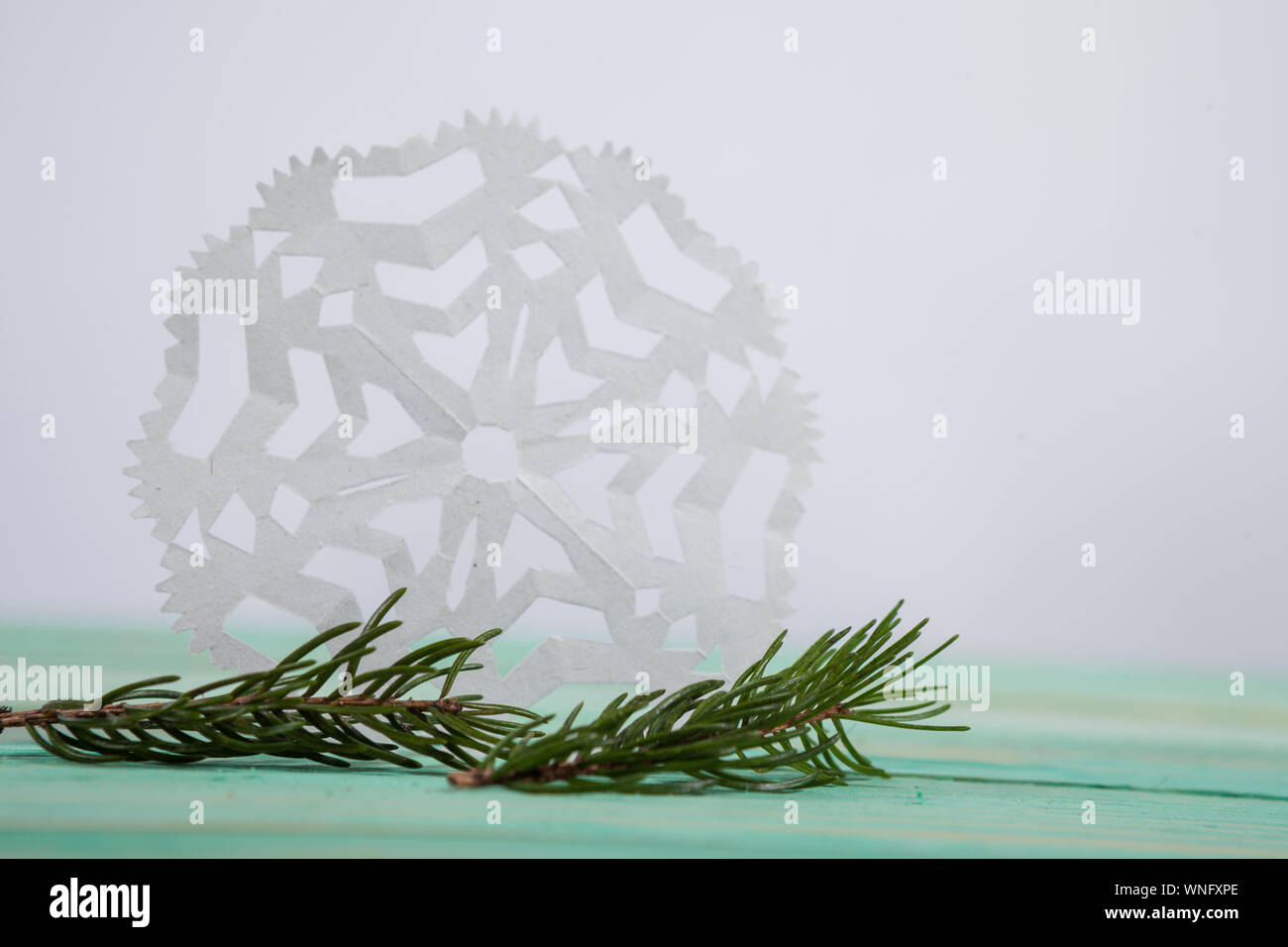 Paper snowflake and tied with twine Stock Photo