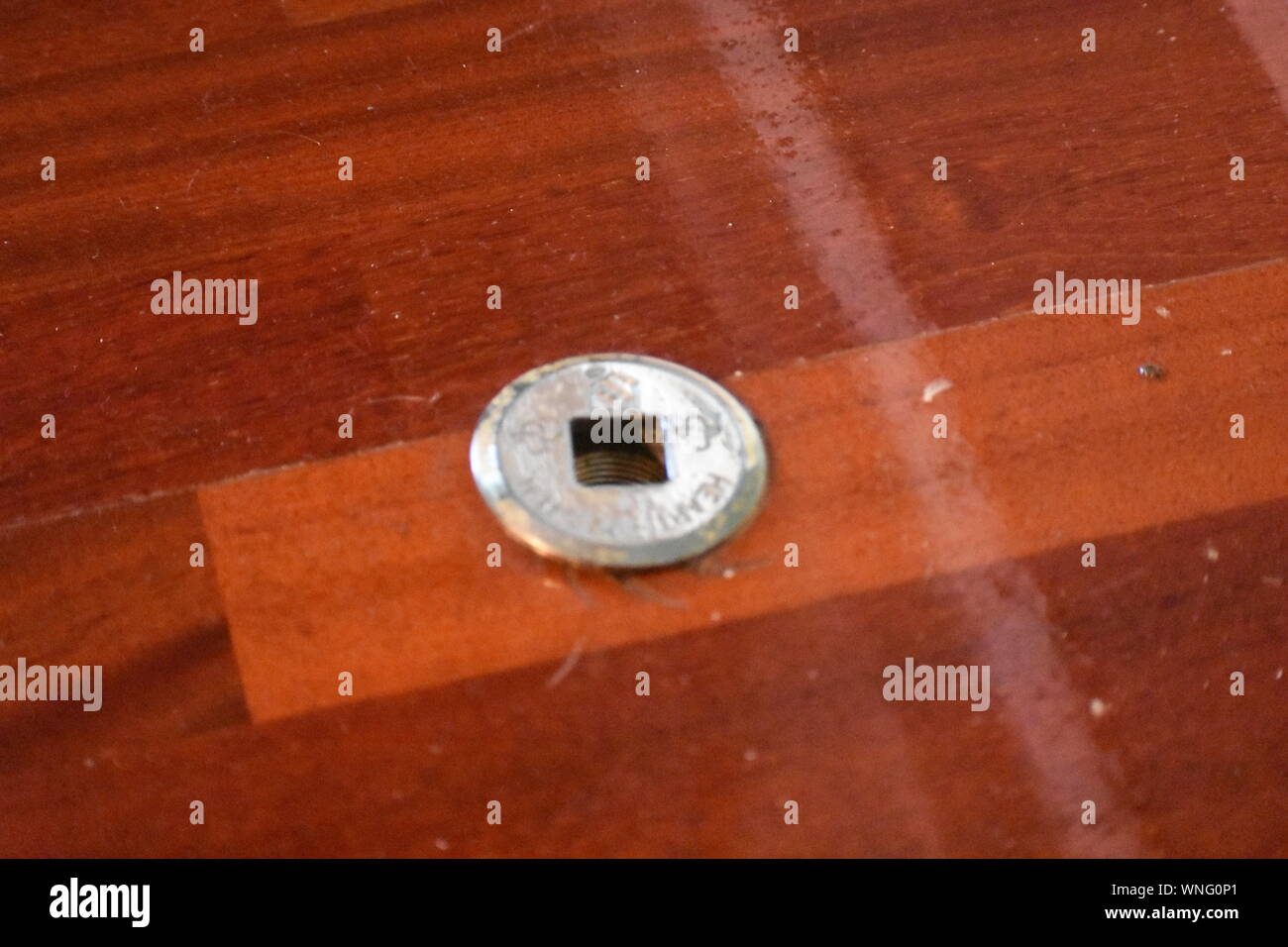 Silver Gas Key For Fireplace On Hardwood Floor With Some