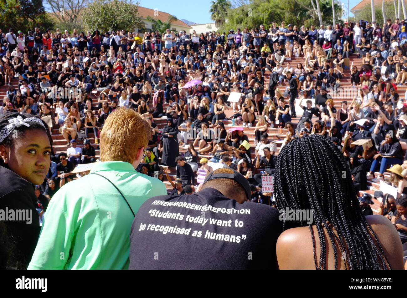 Students from the University of Stellenbosch dressed in black gather to protest against the recent events of gender violence that have rocked South Africa. Several hundred students and staff members held a 2 hour protest at the university demanding action from senior staff members. The protesters come after a series of high profile murders and rapes have shaken South Africa and resulted in calls for action and a national shut down. Stock Photo