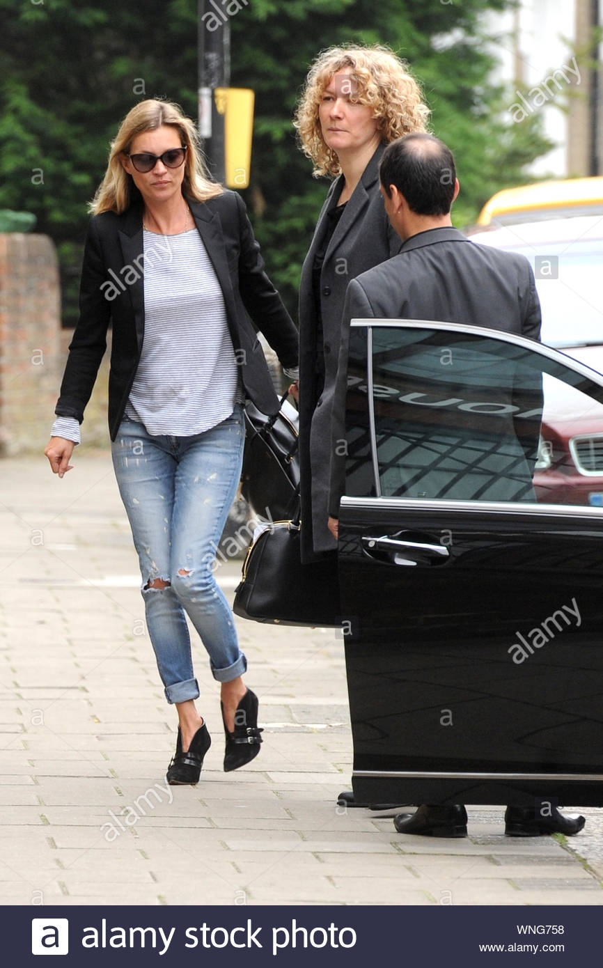 London, UK - Kate Moss rises up early and visits a local studio for a  little business. The legendary supermodel looked cute and casual in a black  blazer to match her suede