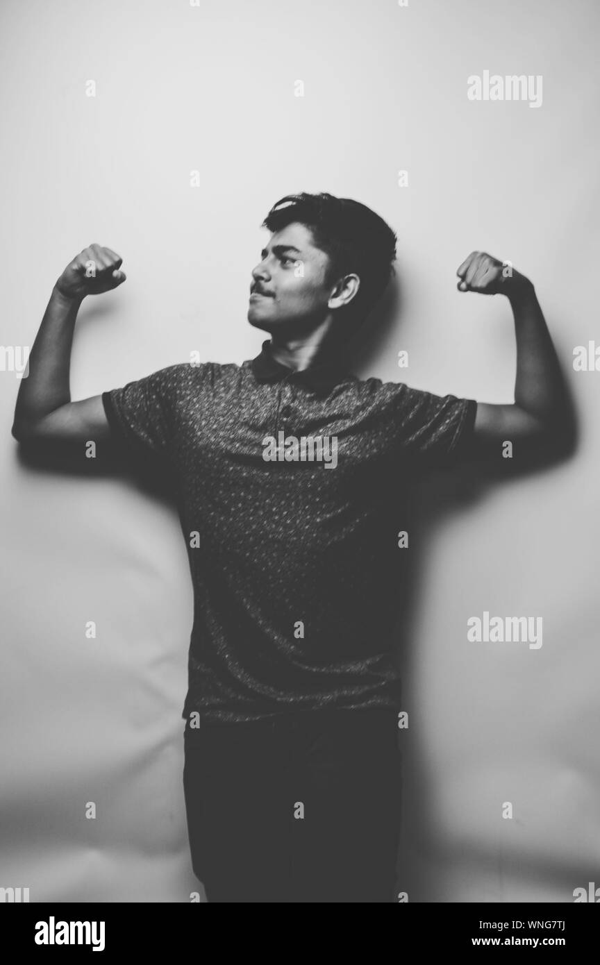 Man flexing his muscles Black and White Stock Photos & Images - Alamy