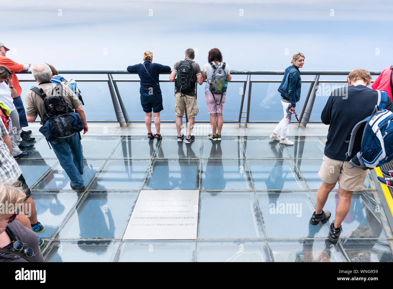 Tourists sightseeing from the  glass viewing platform at Cabo Girão a high cliff in Madeira Stock Photo