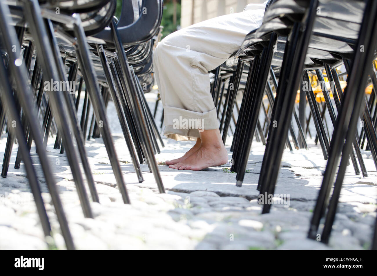 Sitting in chair barefoot hi-res stock photography and images - Alamy