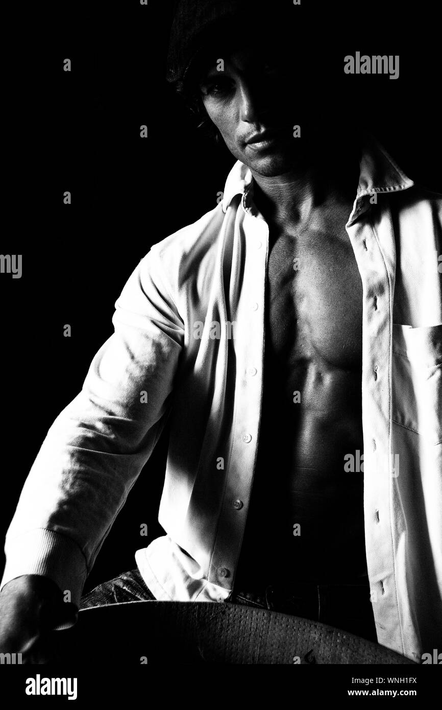 Muscular shirt Black and White Stock Photos & Images - Alamy