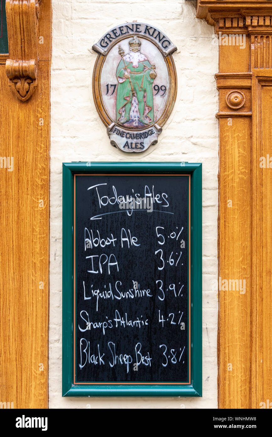 A blackboard ;listing tdays ales and beers outside a Greene King pub in Cambridge UK Stock Photo