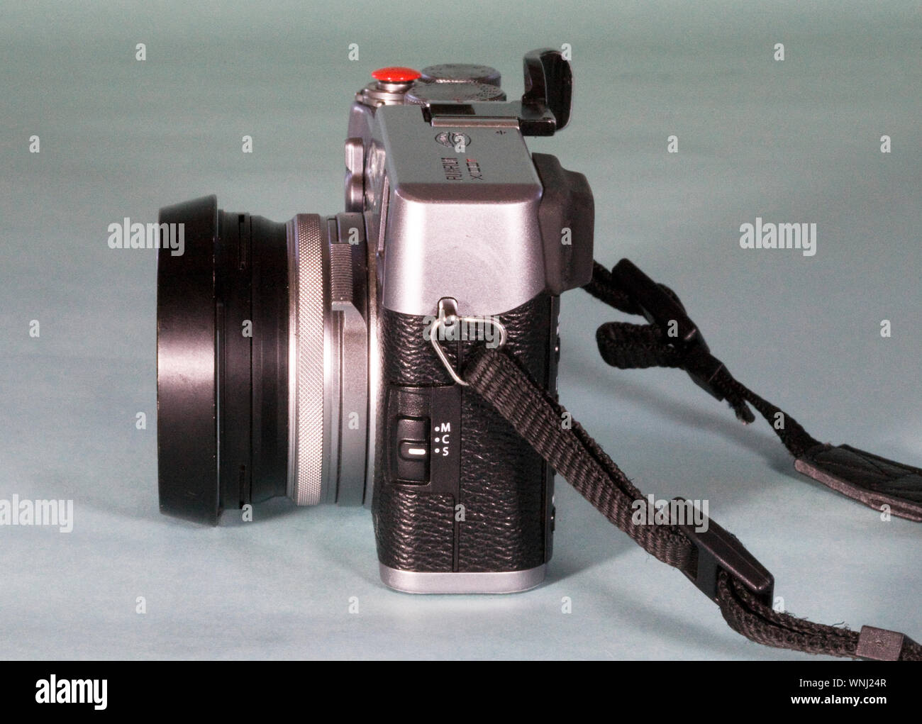 Detail of a Japanese made, DSLR camera, made by Fuji, with a fixed focus lens. Stock Photo