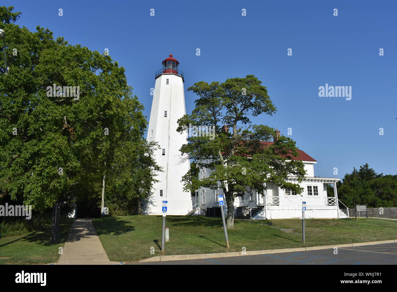 Lighthouse in Sandy Hook, New Jersey, during daylight hours, with the
