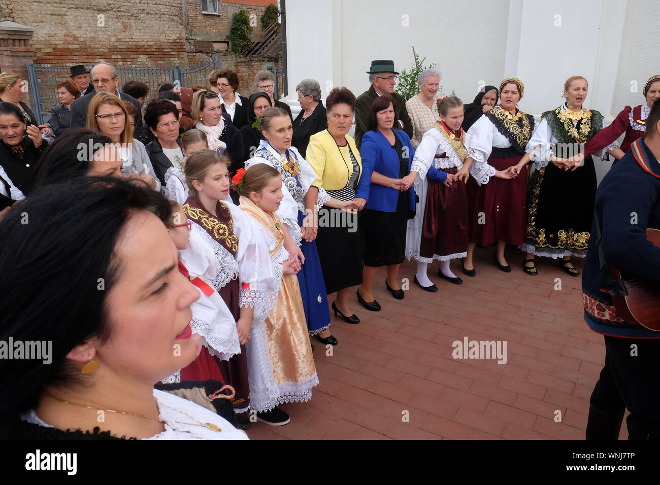 People sing and dance after the Mass on Thanksgiving day in Stitar, Croatia Stock Photo